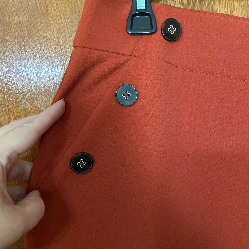Burnt orange trousers with side buttons